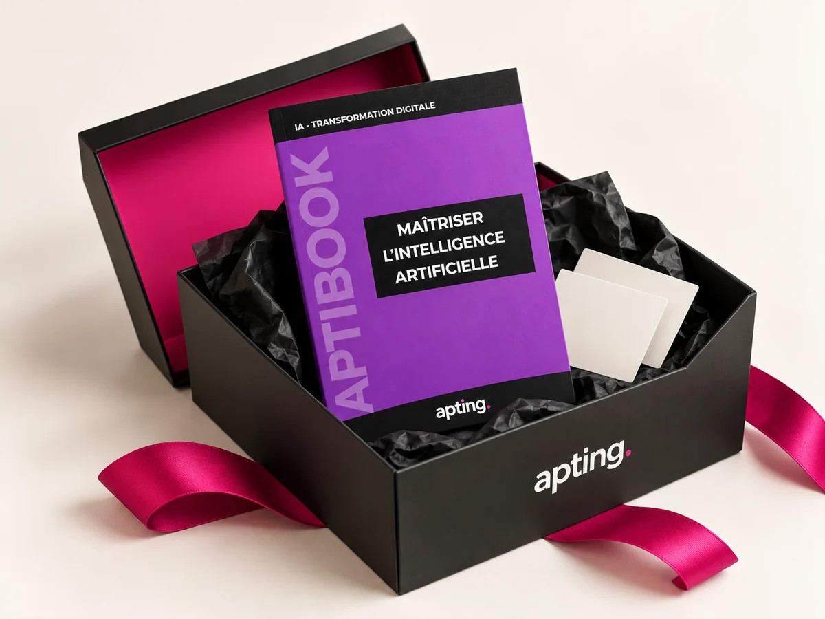 L’Aptibox ouverte avec l’Aptibook violet et des supports de formation